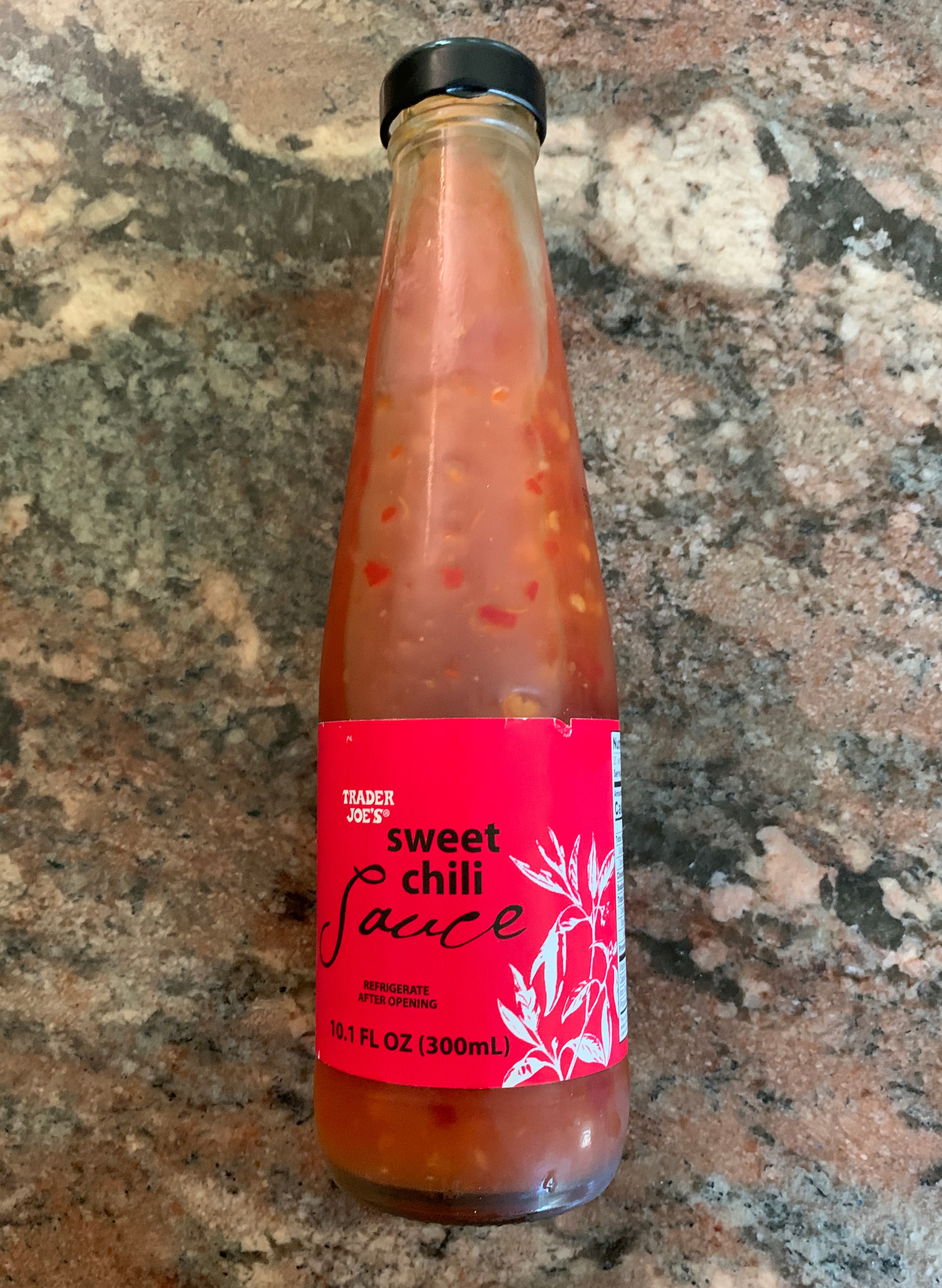 The Sweet chili Sauce bottle laying on a counter