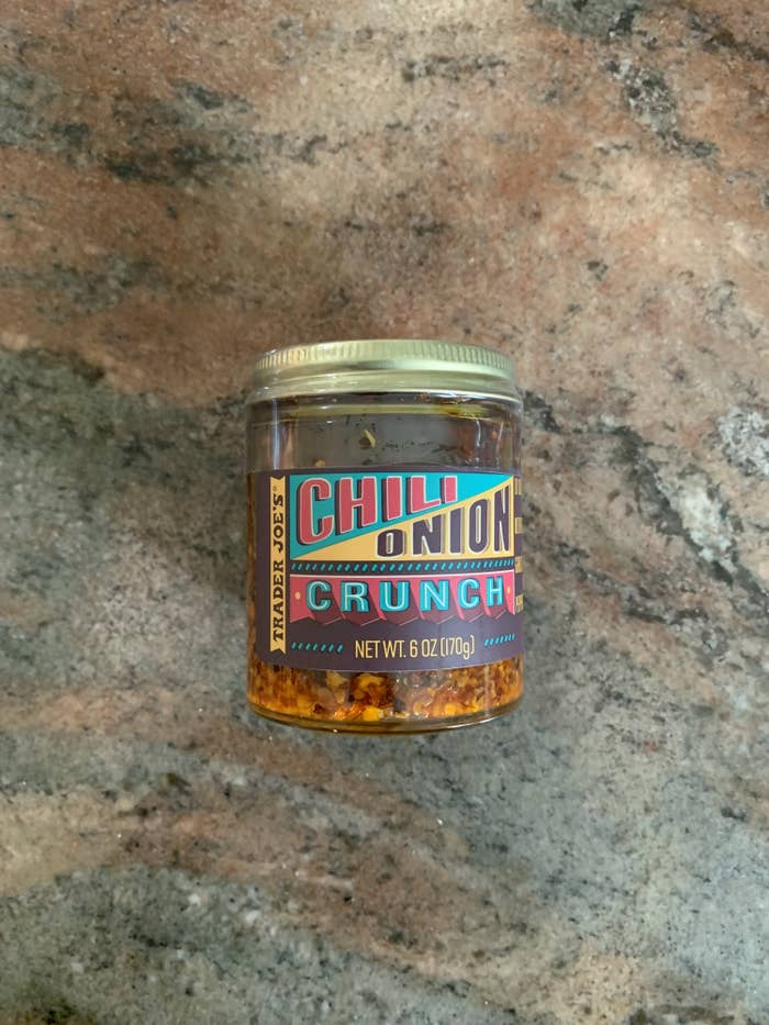 A jar of chili onion crunch on the counter