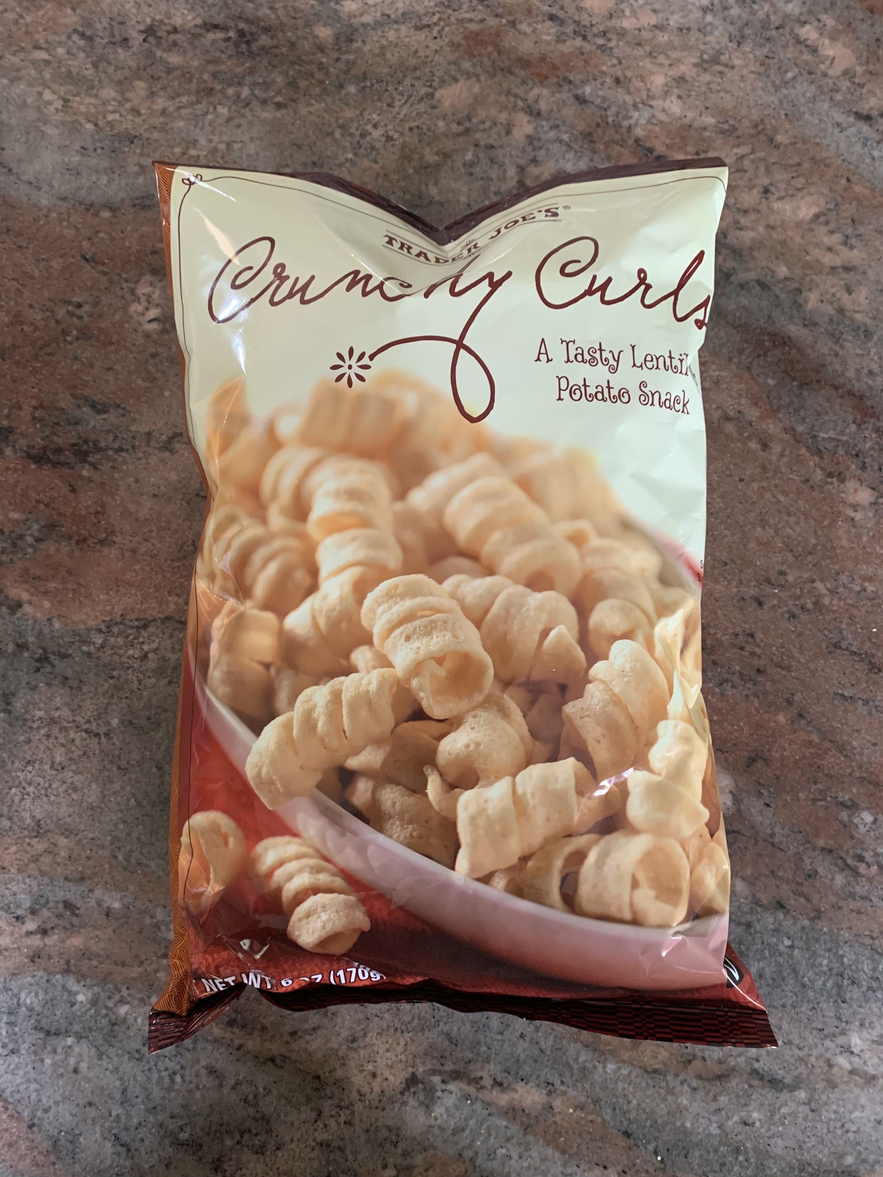 A bag of the crunchy curls laying on the counter