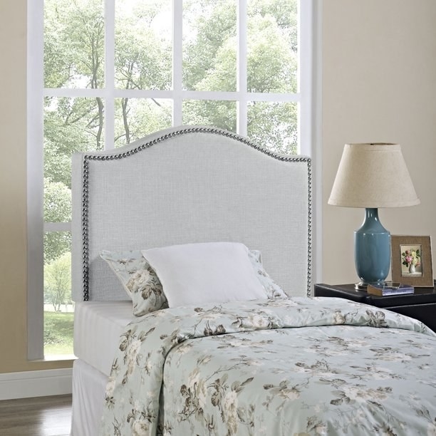 grey headboard with floral bedspread