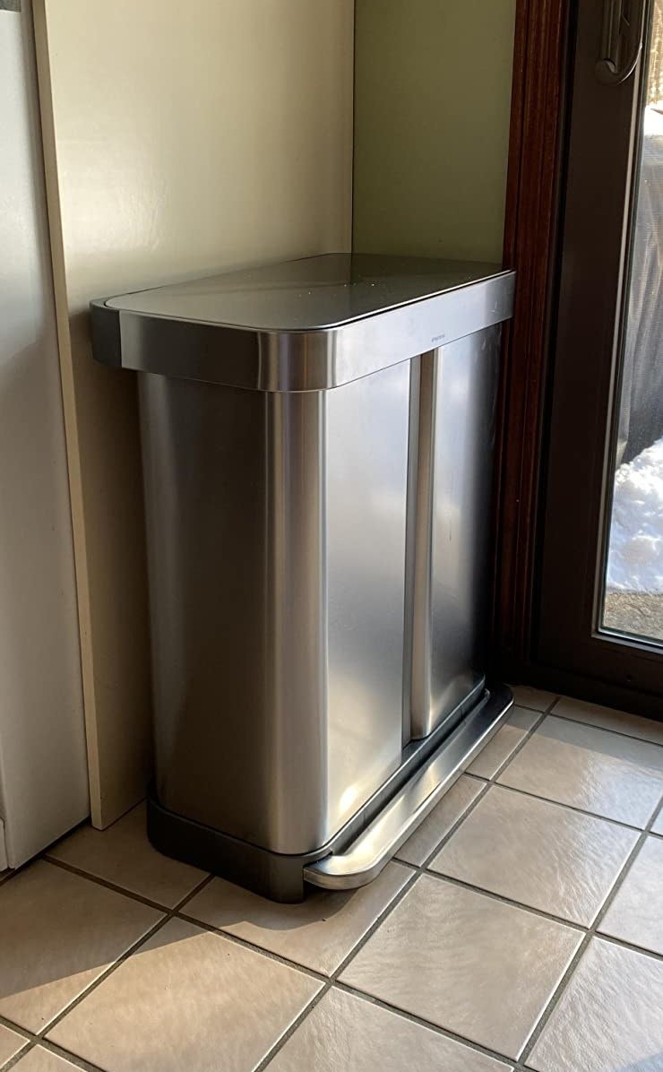 reviewer photo of stainless steel simplehuman dual compartment trash can