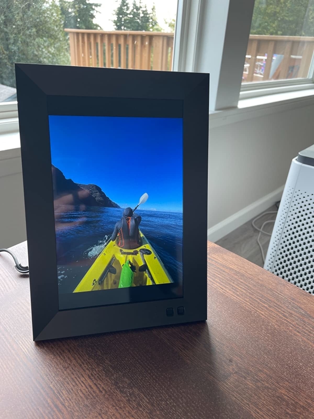 reviewer photo of digital photo frame on a table