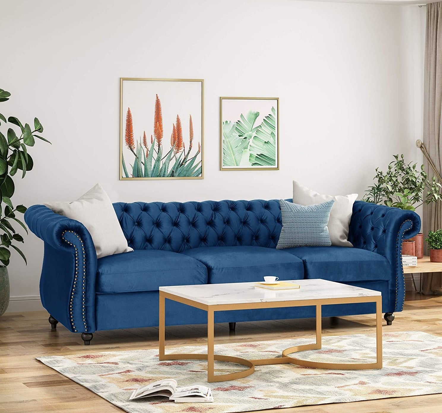 A blue couch with white and blue pillows