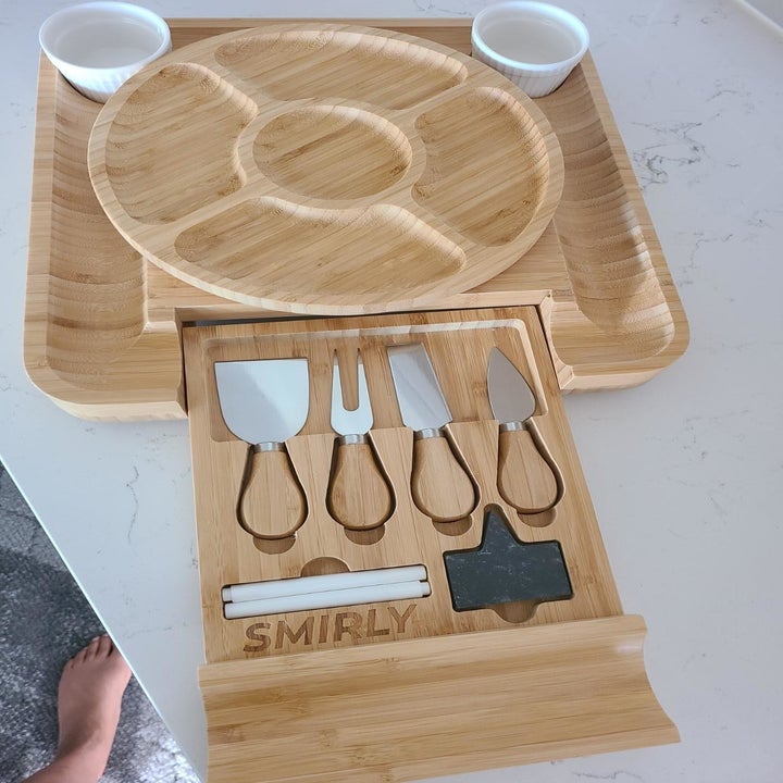 the full cheeseboard set with the knife drawer pulled out, removable circle tray, and two white sauce holders