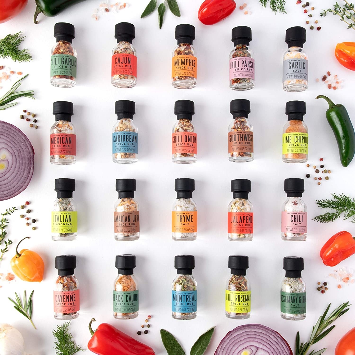 the full set of spices on a white background with peppers and onions around them