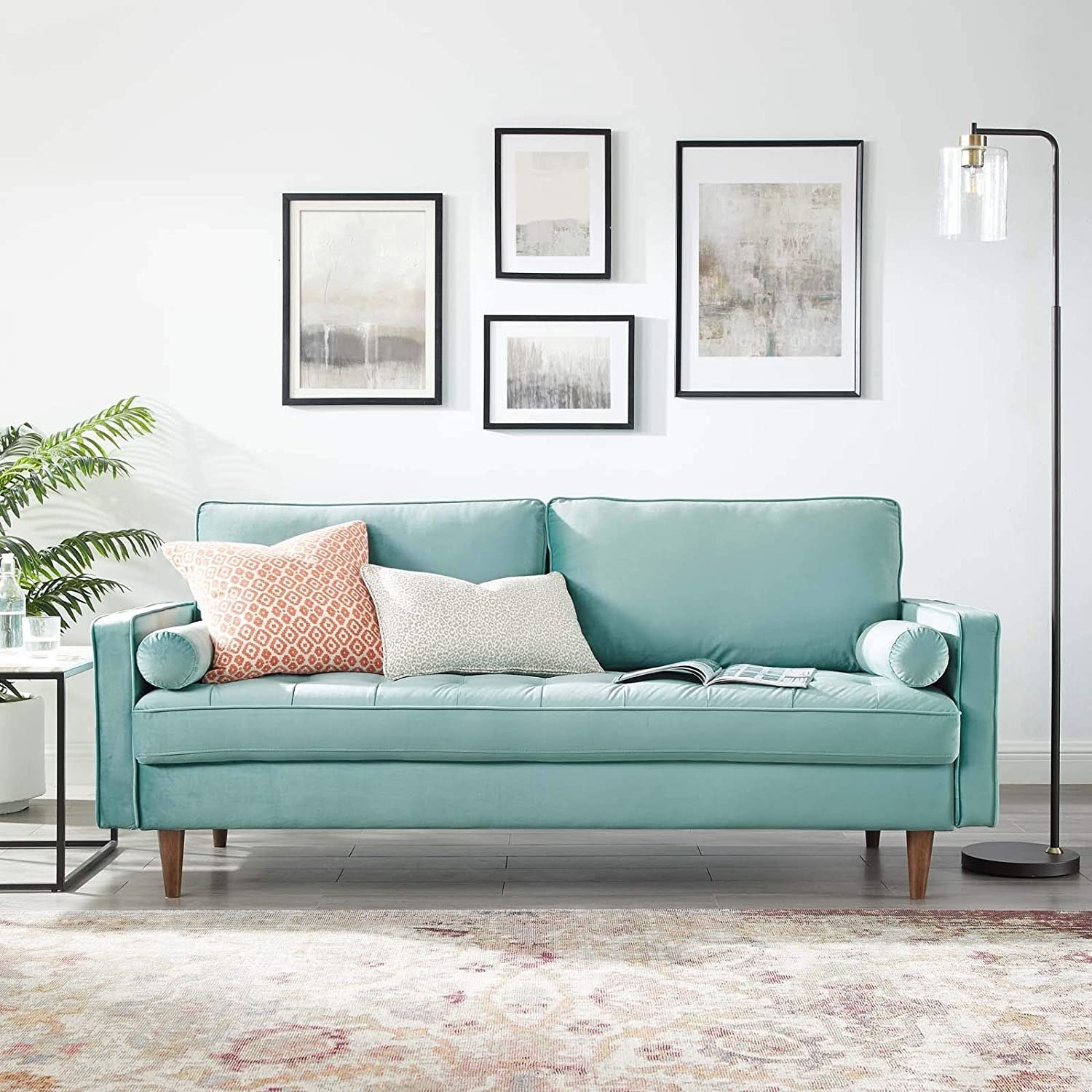 A light blue couch in a white room