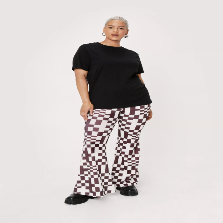 model in flared geometric pants