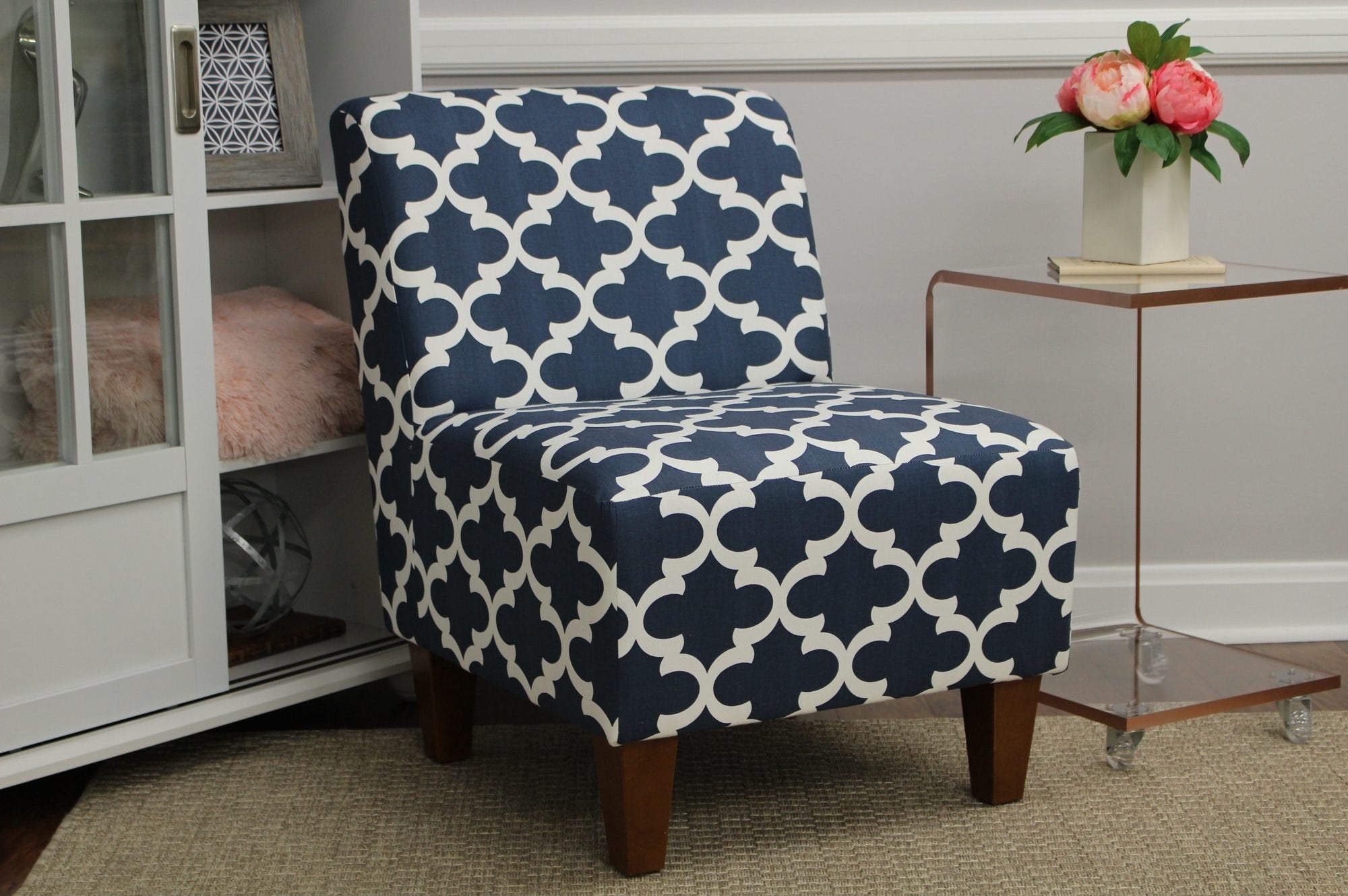 the blue and white patterned chair in a decorated corner