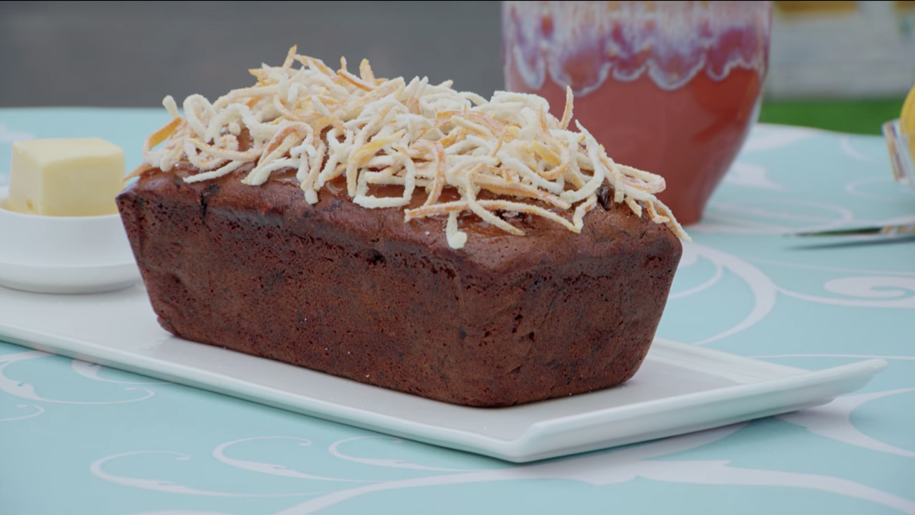 A malt loaf, with dried orange on top