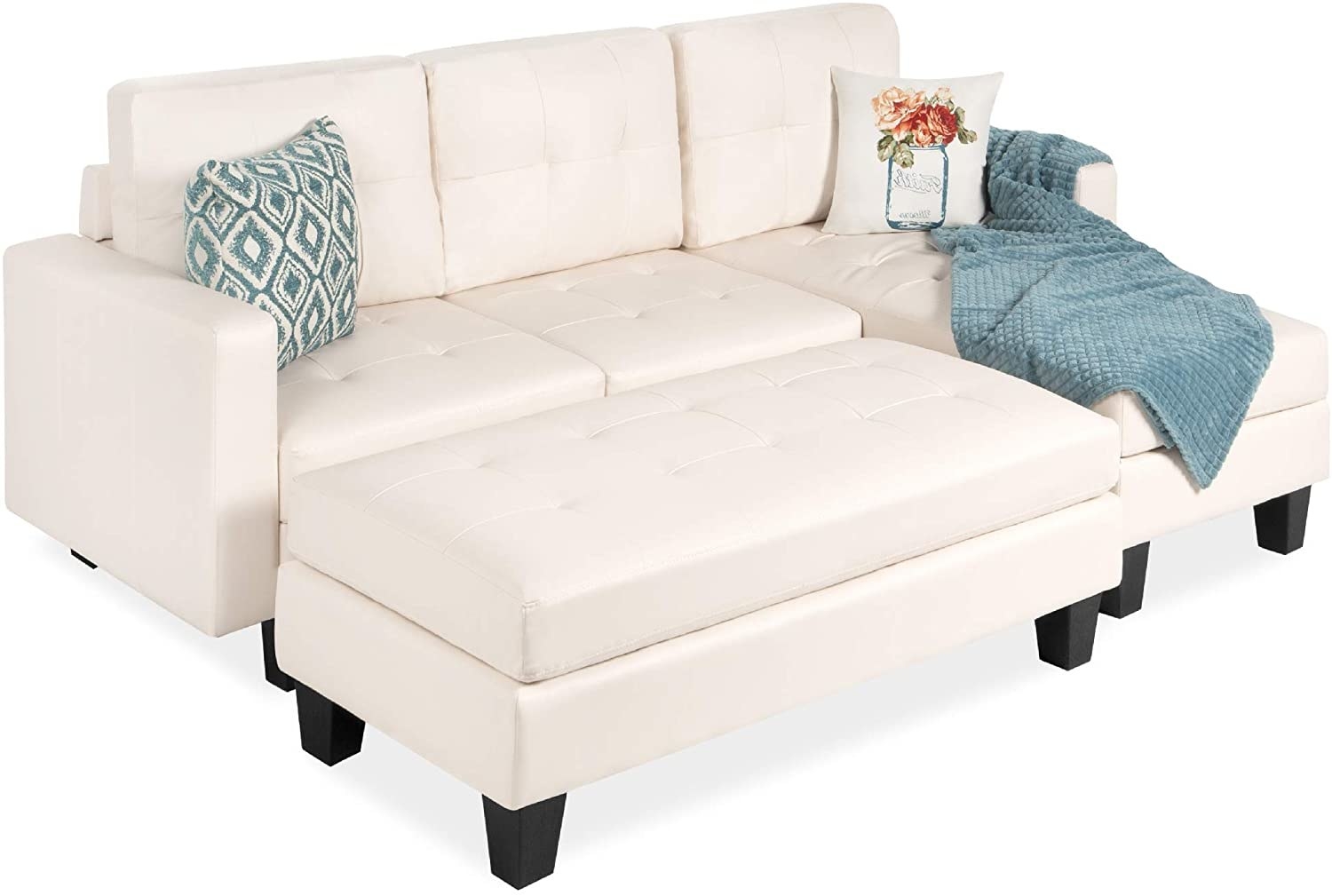 A white faux leather couch with blue accents