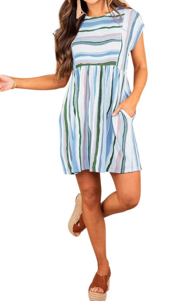 A model wearing a blue/white/green/pink striped round neck mini dress with pockets