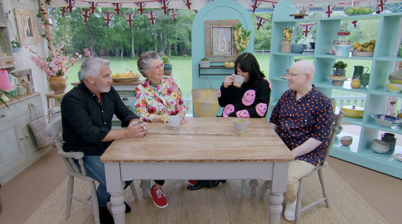 The judges and hosts enjoying a cup of tea together