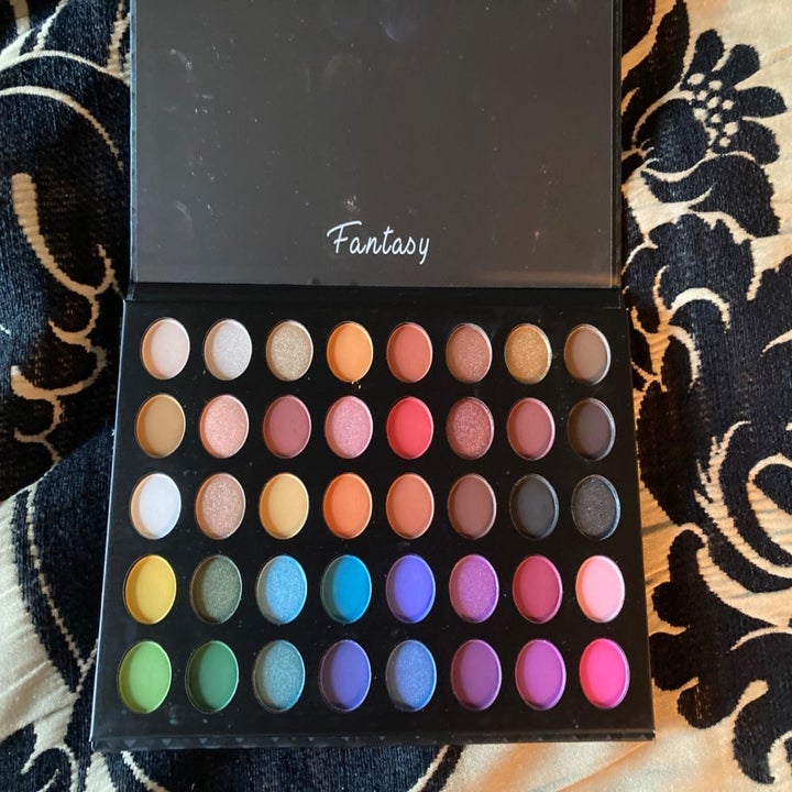 the full palette with blue, green, pink, yellow, orange, black, white, and red shades