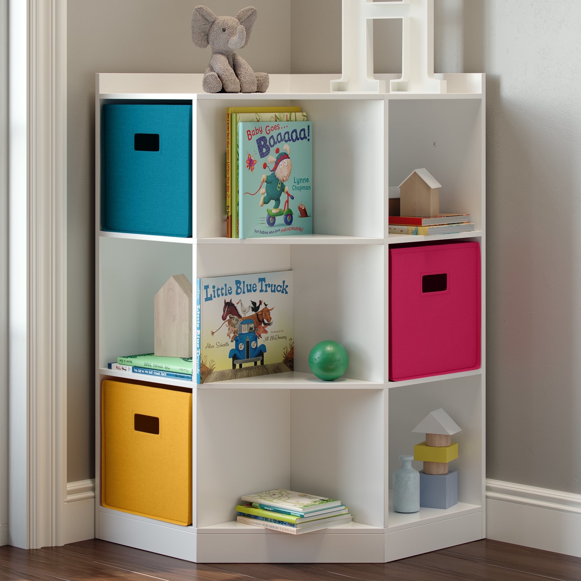 the cubby in a corner with toys and books
