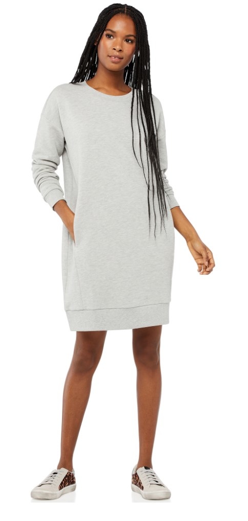 A model wearing a long-sleeve, grey sweatshirt dress