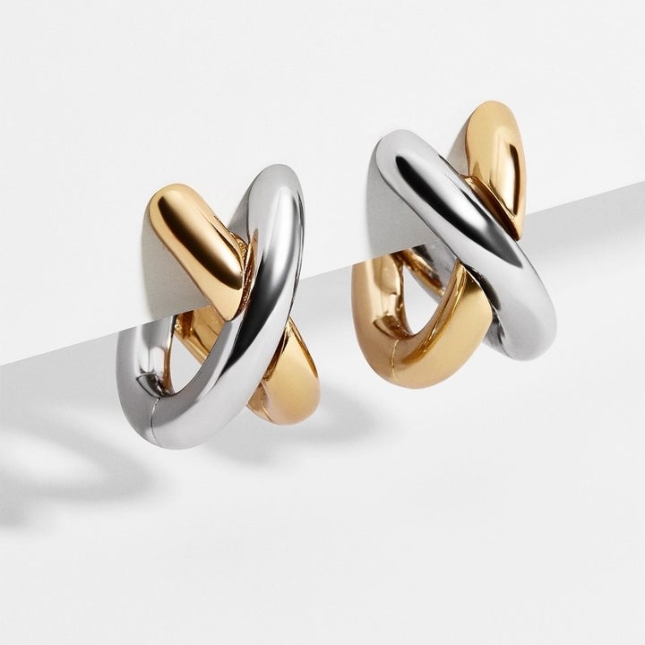 gold and silver crossed hoops