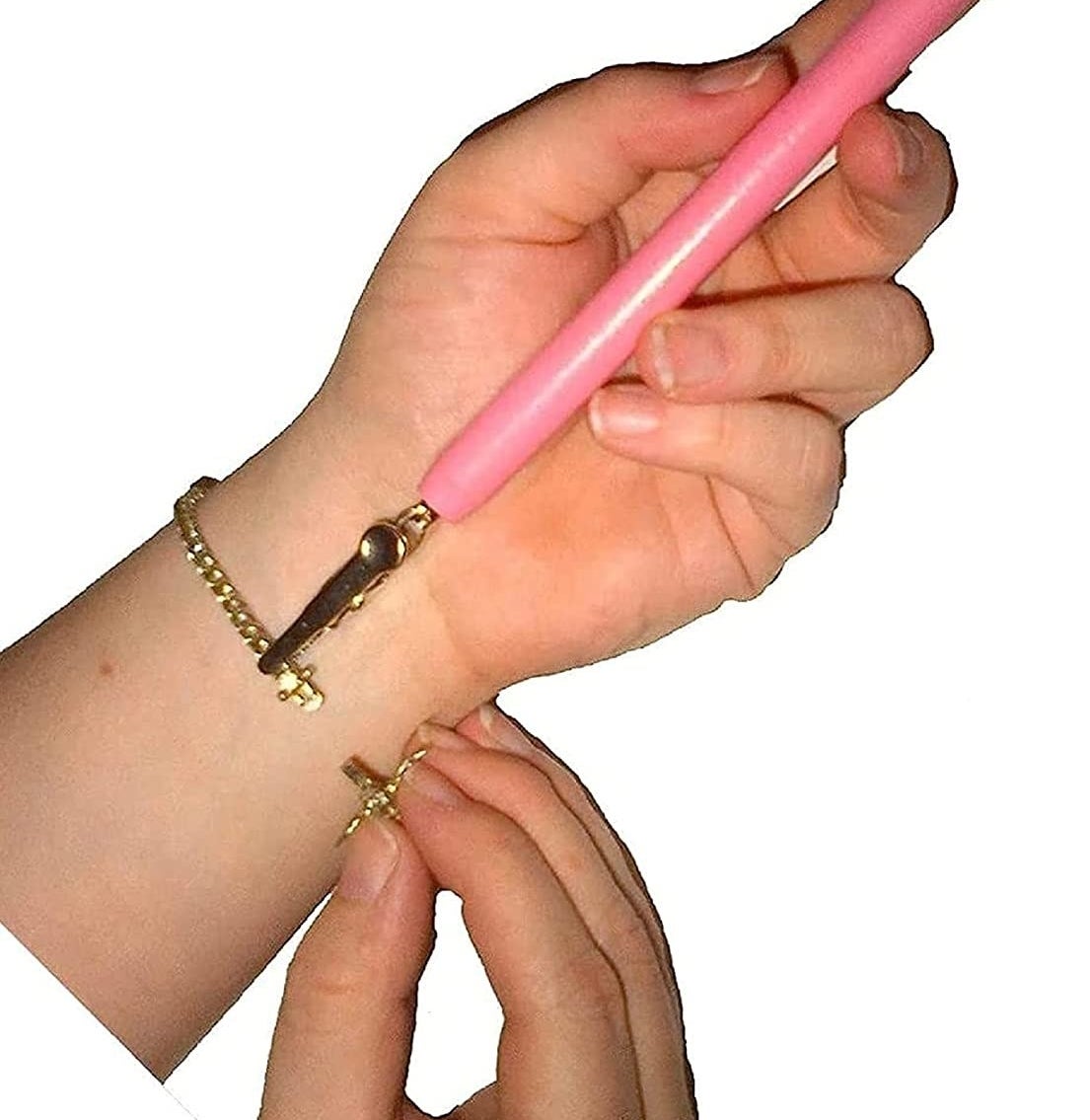 Model using the tool to put on a small bracelet by themselves