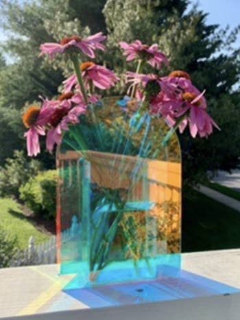 Reviewer's colorful vase casting rainbows while in the sun