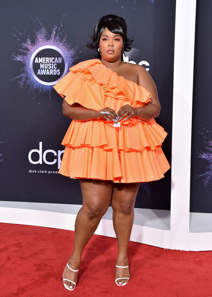 Lizzo holding a tiny purse