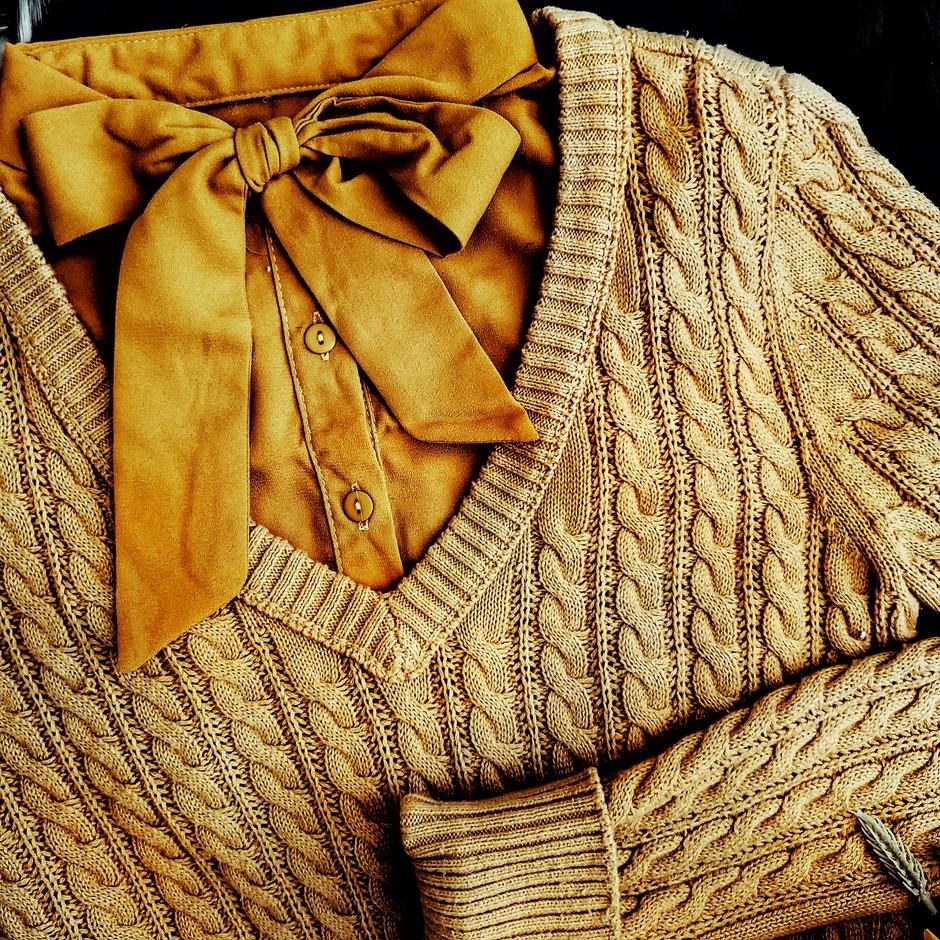 The yellow removable collar under a v-neck sweater