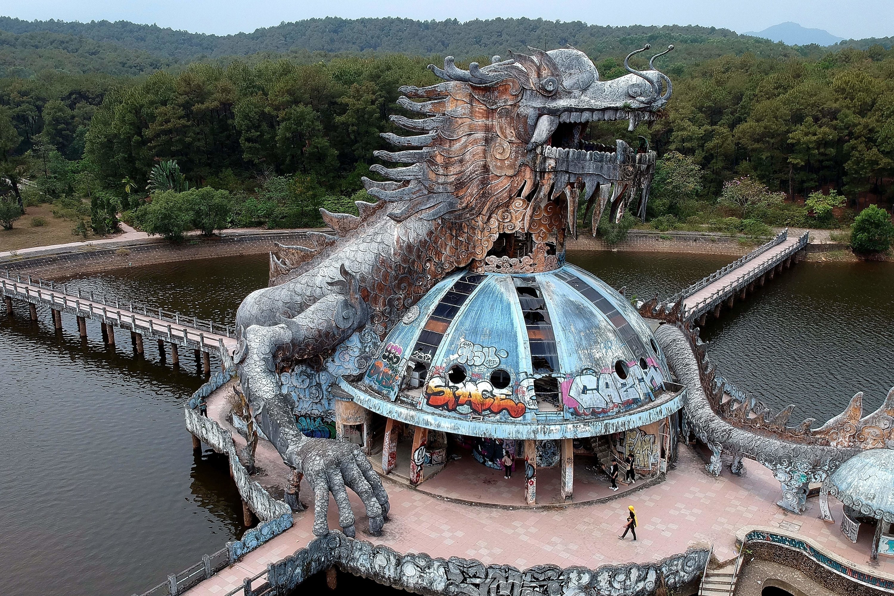 Abandoned waterpark with graffiti and desolate dragon staircase