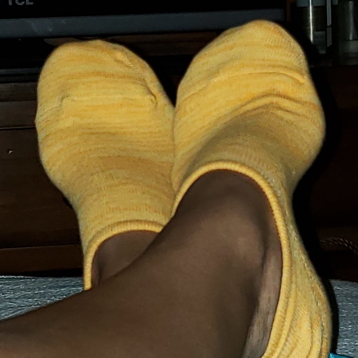 Reviewer wearing yellow socks