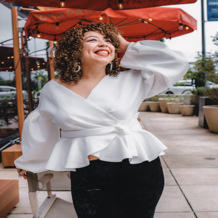 reviewer wearing the white top