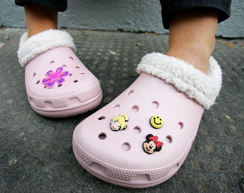 A woman wearing crocs with Jibbitz