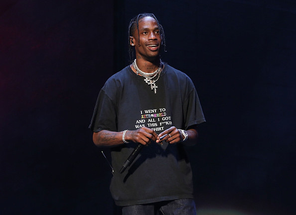 Travis smiling onstage