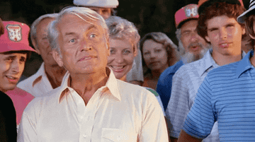 Gif of Ted Knight sneering, &quot;well...we&#x27;re waiting&quot; in Caddyshack