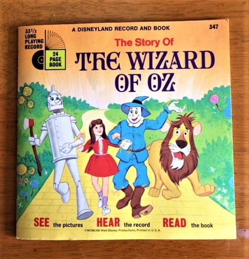 A Disney Book on Record from the &#x27;70s, featuring a drawing of the Tin Man, Dorothy, Scarecrow, and Cowardly Lion walking down the Yellow Brick Road