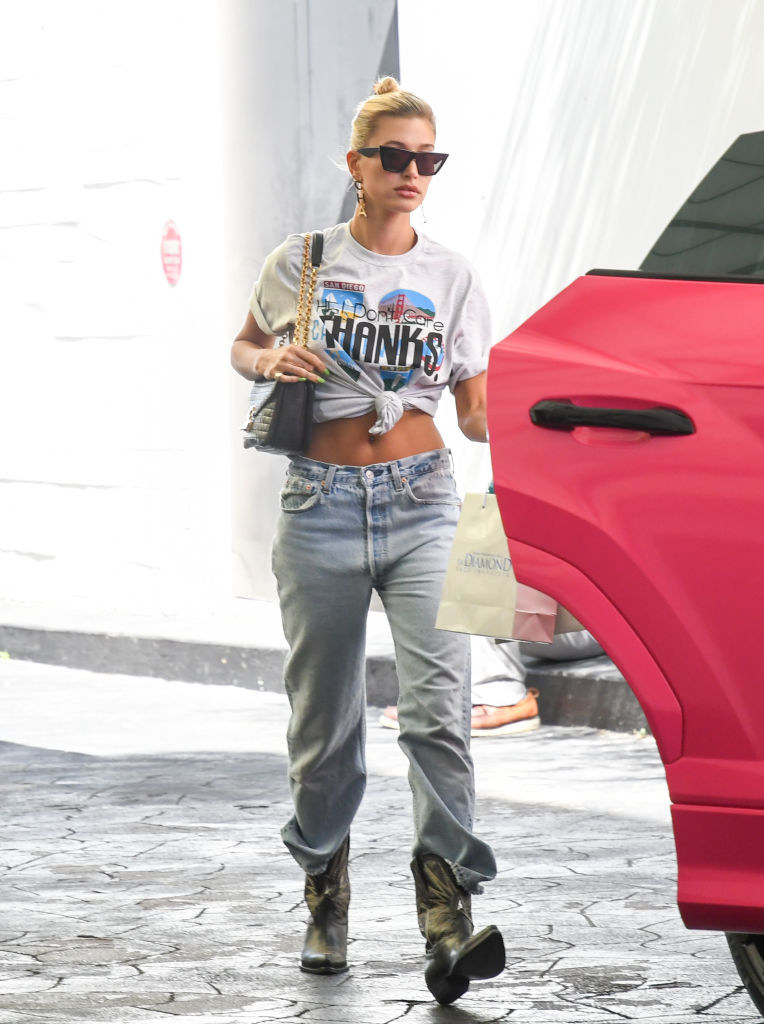 Hailey Baldwin wearing baggy pants and cowboy boots