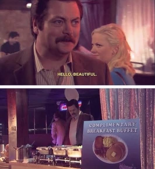 Ron Swanson looking at the breakfast buffet sign.