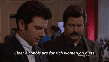 GIF of Ron explaining to Ben that clear alcohol is for women on diets