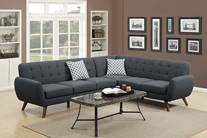 dary gray L-shaped sectional with curved edges and wood legs