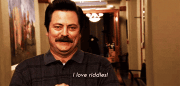 GIF of Ron Swanson saying he loves riddles.