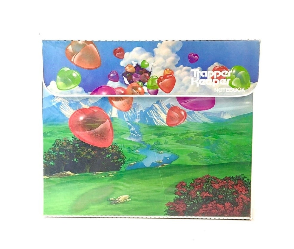 Folder with balloons flying over a mountain side