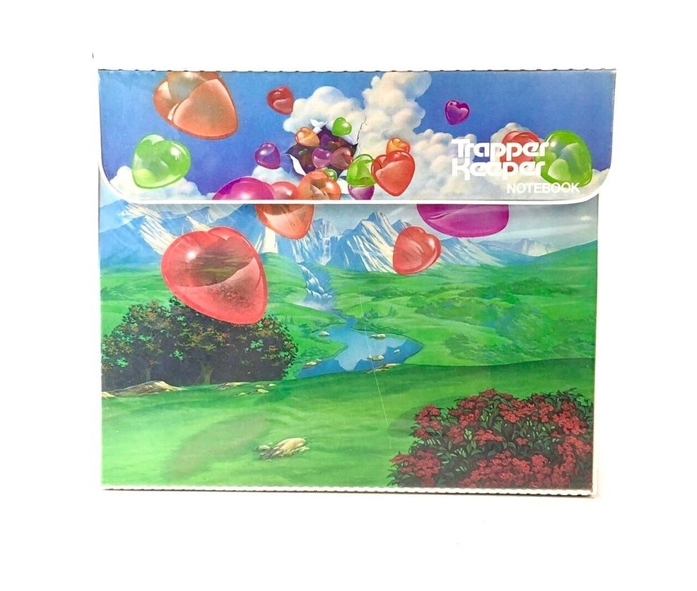 Folder with balloons flying over a mountain side