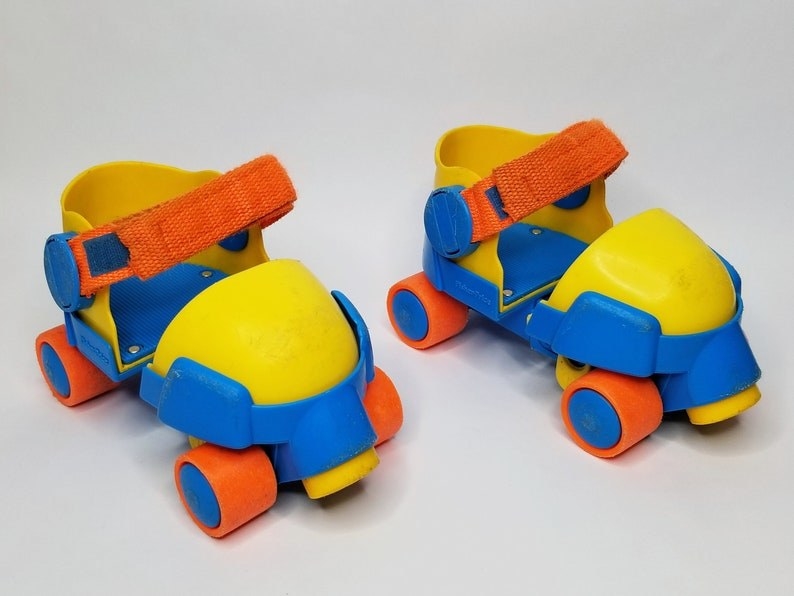 Yellow, blue, and orange pre-school aged skates