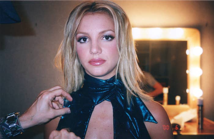 Britney looking serious in a dressing room
