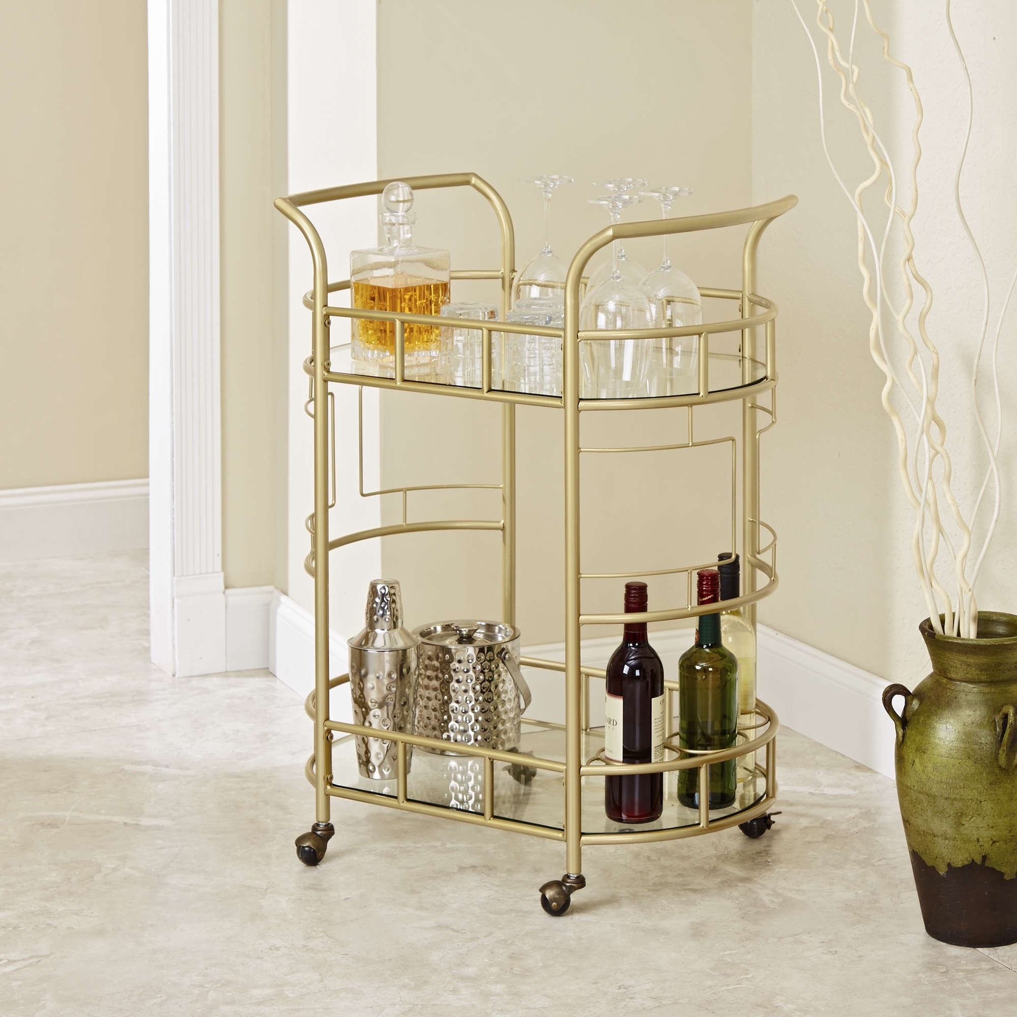 Gold bar cart with various bottles