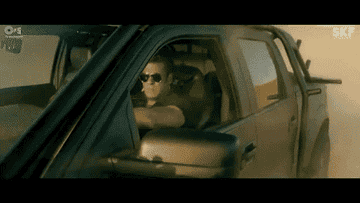 GIF of Salman Khan putting on sunglasses and and then stroking his hair back on both the sides
