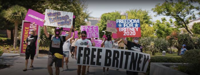 People marching with "Free Britney" posters
