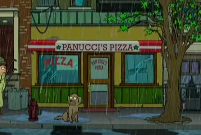 Seymour standing outside Panucci&#x27;s Pizza in the rain