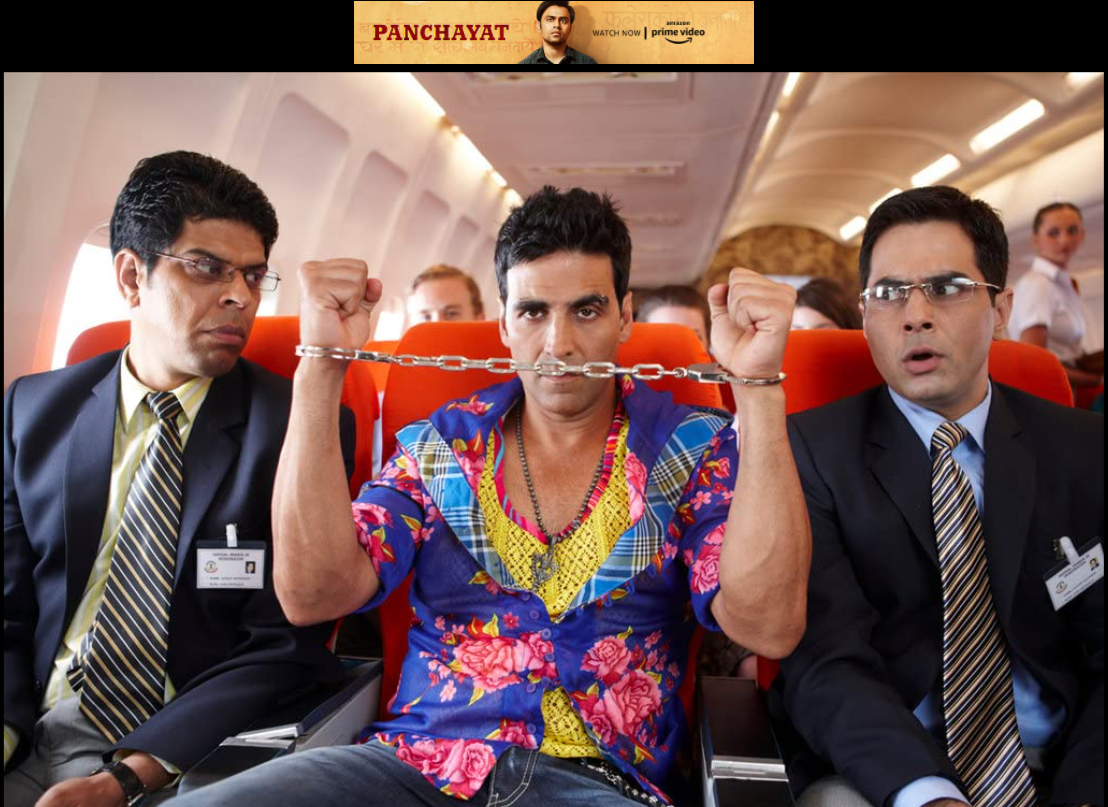 Akshay Kumar sitting in the middle of Murali Sharma and Aman Verma with handcuffs around his hands
