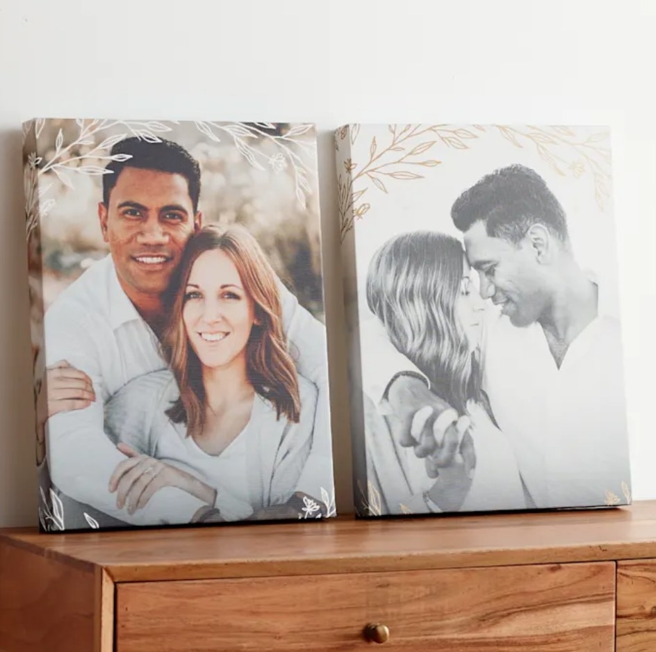 Two canvas prints of a couple displayed atop a dresser