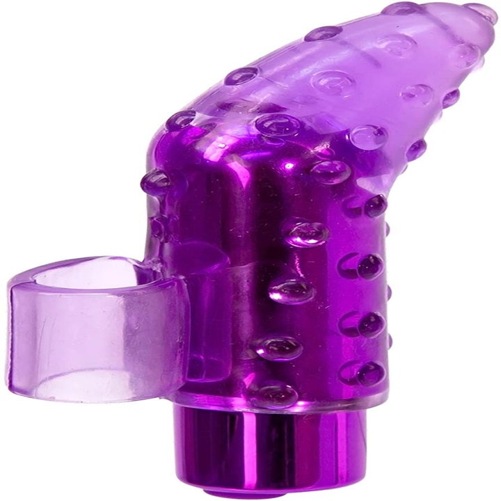 The vibrator with a textured and pointed cover that has a handle for a finger to slide through for easy use