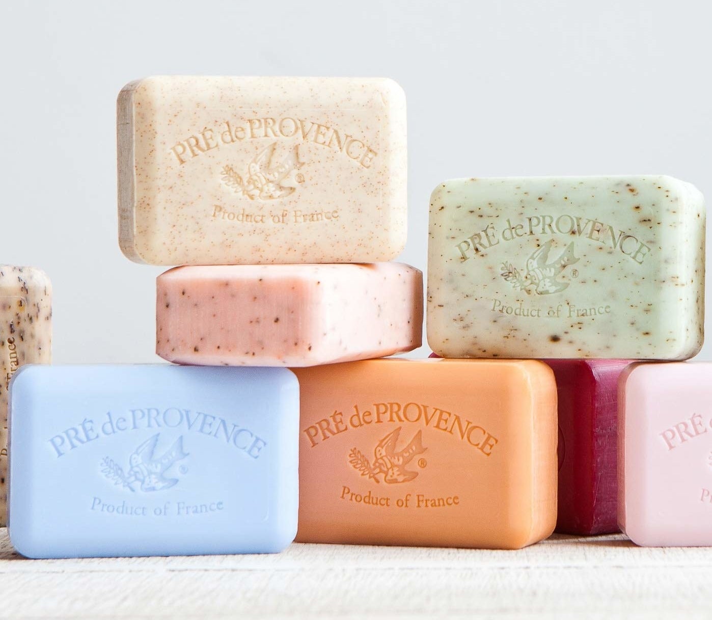 A stack of the colorful soaps engraved with a bird and &quot;Pre de Provence product of France&quot; logo
