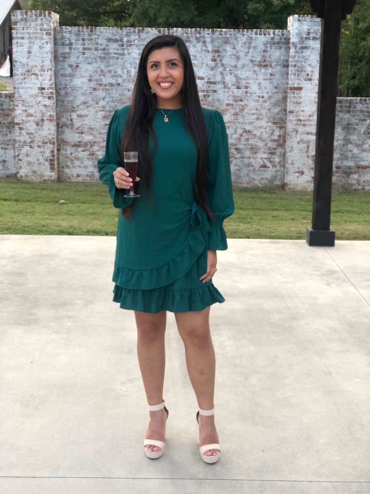 Reviewer wearing green dress