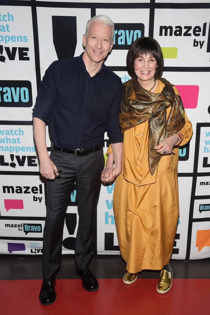 Anderson Cooper and Gloria Vanderbilt holding hands on the red carpet